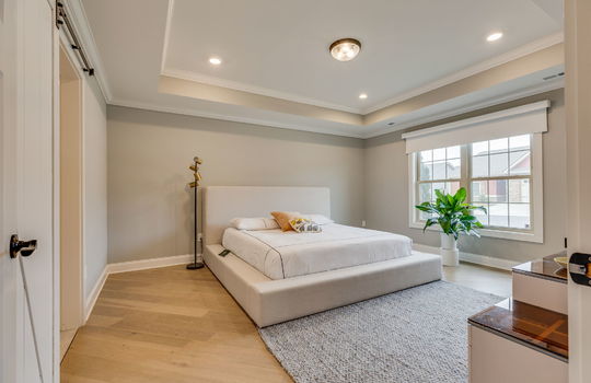 bedroom, tray ceilings, recessed lighting, windows, luxury vinyl flooring