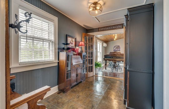 central hallway, tile floor, window, french double doors