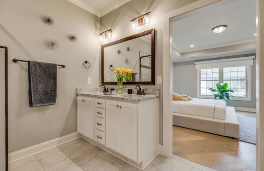 bathroom, sink, tile flooring, double vanity door to bedrrom