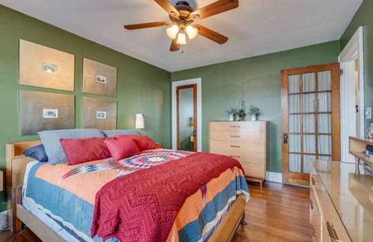 bedroom, closet, ceiling fan, hardwood flooring, glass panel door