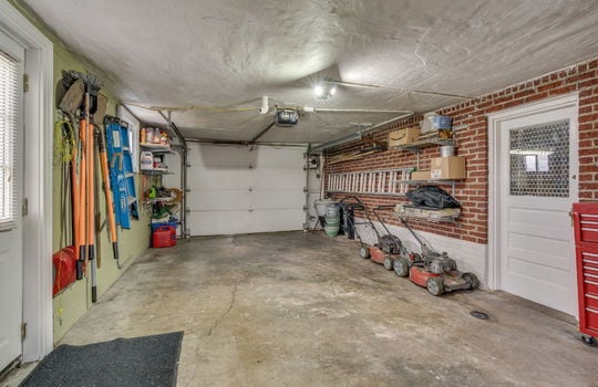 garage, concrete flooring, exterior door, interior door, garage door