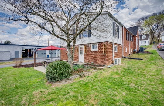 back right view of home, rear patio, landscaping, brick, vinyl siding
