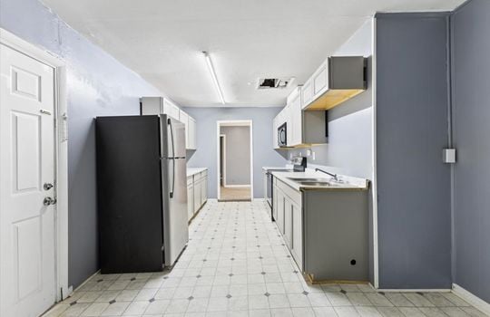 kitchen, refrigerator, sink, stove/oven, microwave, cabinets, countertops