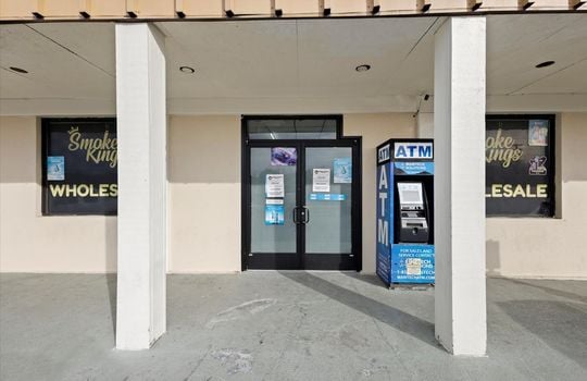 commercial building, covered front entrance, double door entrance, windows