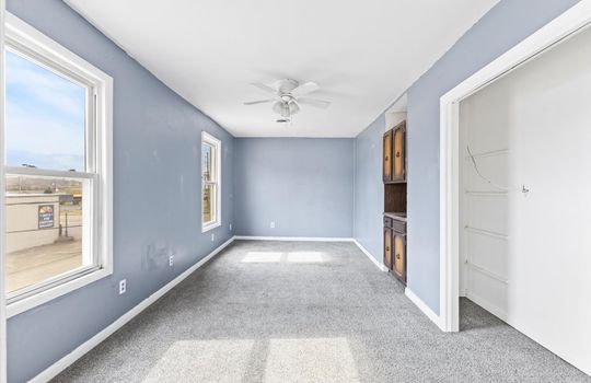 dining area, ceiling fan, built in cabinet, carpet, windows