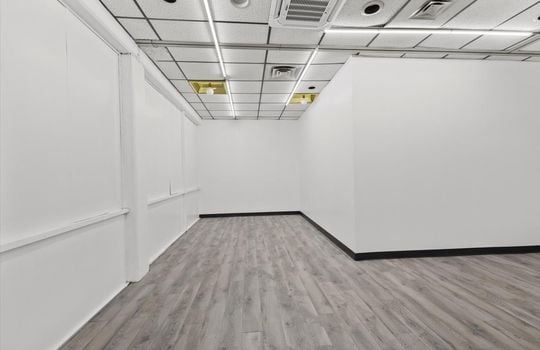 office/storage room, door, ceiling tiles, fluorescent lighting