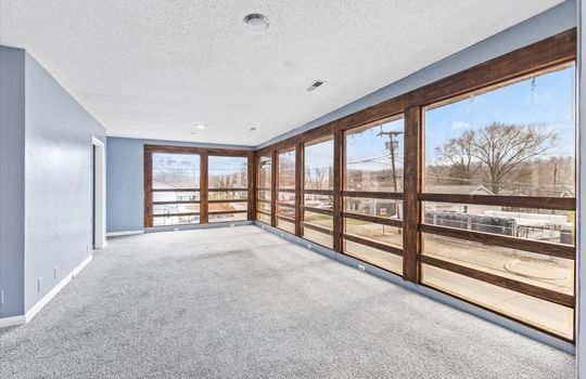 living room, carpet, floor to ceiling windows