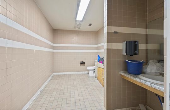 bathroom, tile walls, tile flooring, sink, toilet