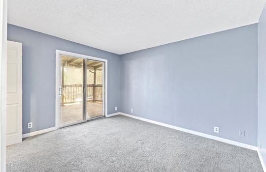 bedroom, carpet, deck access door