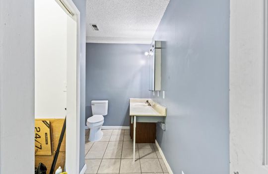 bathroom, sink, toilet, cabinet