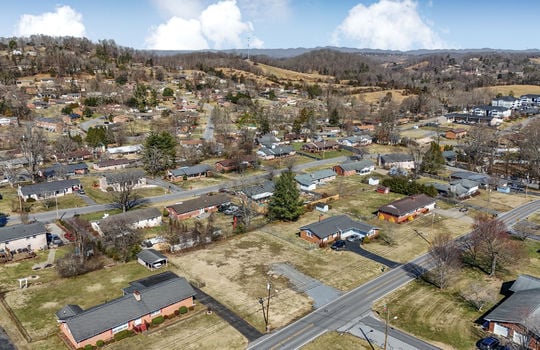 aerial view, 0.37+/- acres, road, neighboring properties, mountains