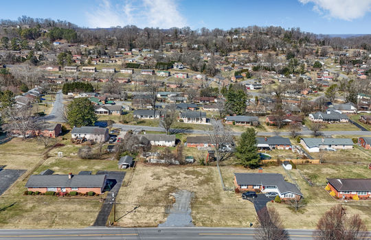 aerial view, 0.37+/- acres, road, neighboring properties, mountains