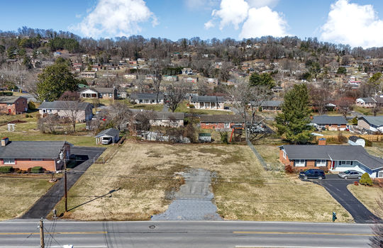aerial view, 0.37+/- acres, road, neighboring properties, mountains