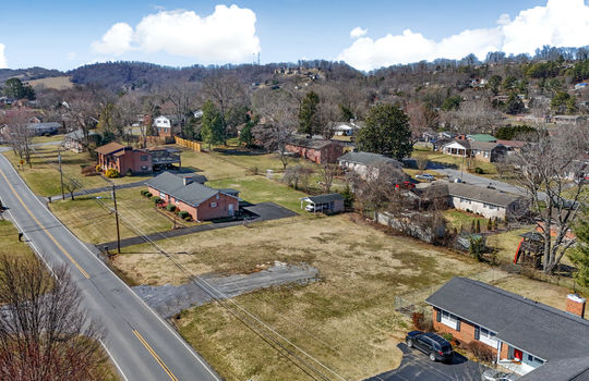 aerial view, 0.37+/- acres, road, neighboring properties, mountains