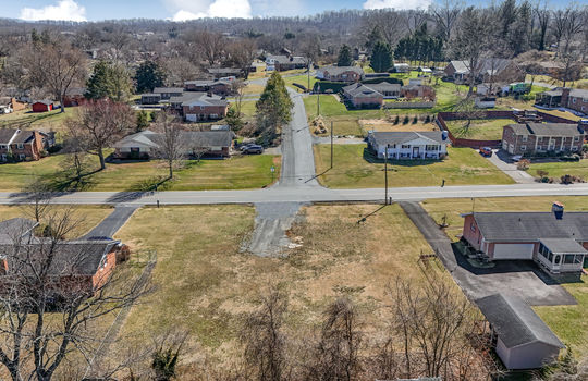 aerial photo, 0.37+/- acres, trees, road, neighboring properties