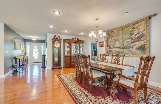 front door, entry hallway, dining space, hardwood flooring, recessed lighting
