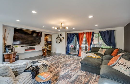 living room, recessed lighting, tile flooring, glass door to patio area