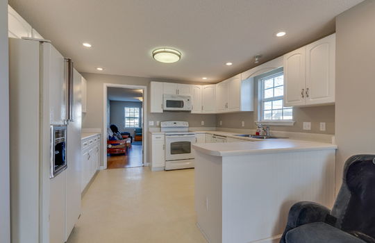 office kitchen, window, sink, refrigerator, cabinets, countertops, microwave, dishwasher, oven/range, reception/waiting areas