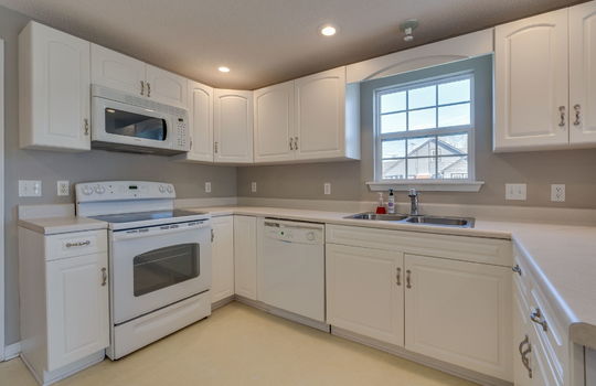 office kitchen, oven/range, microwave, dishwasher, cabinets, countertops, window, sink