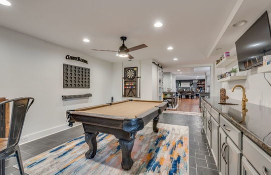 flex room, game room, ceiling fan, recessed lighting, cabinets, granite countertops, wetbar