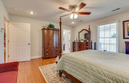 bedroom, hardwood flooring, ensuite bathroom, recessed lighting, ceiling fan, window