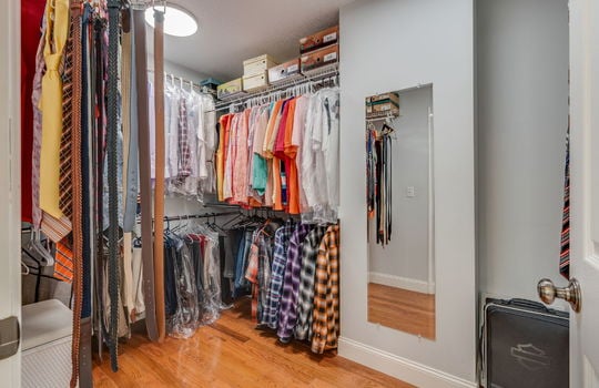 walk in closet, hardwood flooring, shelving