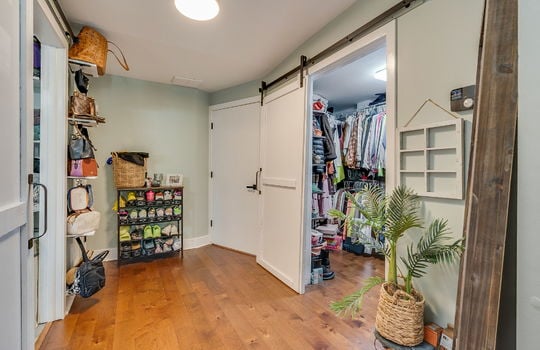 upper level, landing, storage, walk-in closet, hardwood flooring, barn door