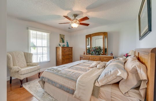 bedroom, hardwood flooring, ceiling fan, window