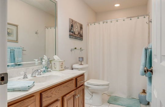 bathroom, tile flooring, toilet, sink, shower/tub
