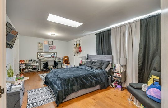 bedroom, hardwood flooring, skylight, closet