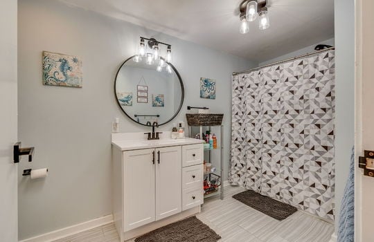 bathroom, shower/tub, sink tile flooring