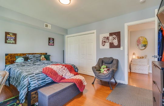 bedroom, hardwood flooring, closet, door