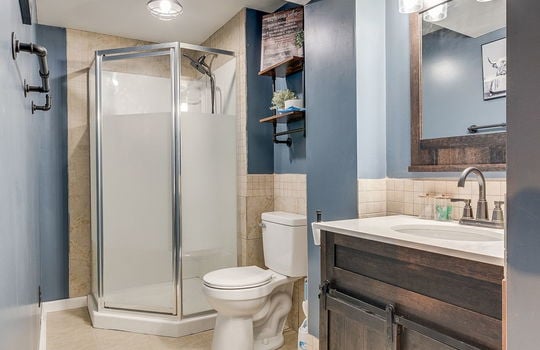 bathroom, tile flooring, sink, shower, toilet
