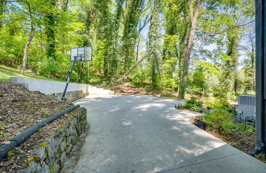 driveway, retaining wall, trees, landscaping