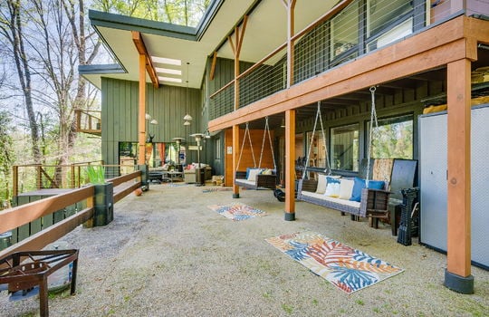 back patio, back deck, back balcony, glass entry doors, wood siding, contemporary home