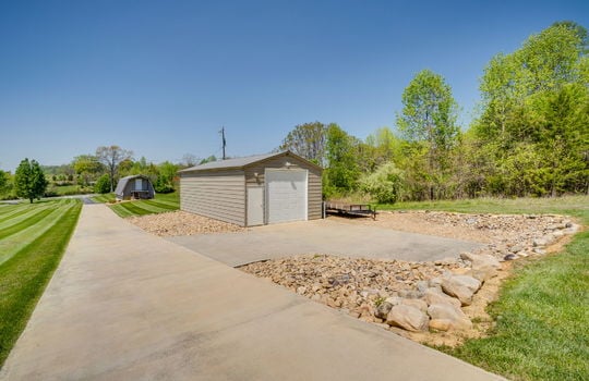 garage/workshop/outbuilding, landscaping, concrete pad, private drive