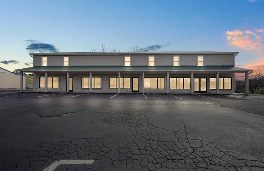 Commercial space for lease, commercial building, parking lot, display windows, doors, windows, metal roof
