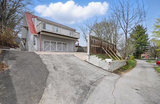 bungalow, for lease, two car garage, driveway, brick paver patio, deck, vinyl siding, metal roof, fencing