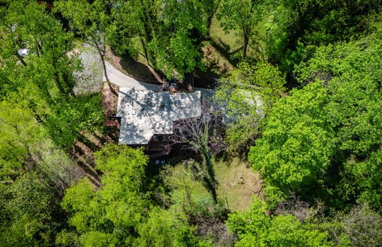 102aerial view of home, back yard, roof, driveway, parking, trees