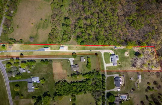 aerial view of property, property outline, driveway, house, road, trees