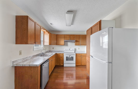 kitchen, refrigerator, dishwasher, oven/range, sink, cabinets, countertops, laminate flooring