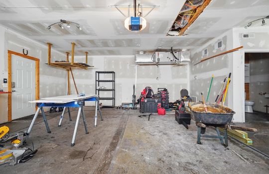 garage, workspace, two car garage, shelving, half bath, door access to main level