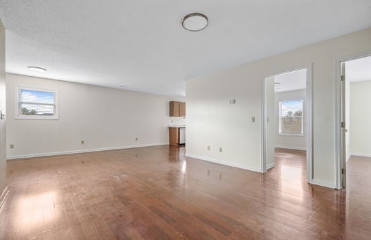 living room, laminate flooring, bedroom doors