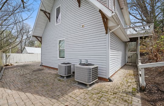 side view, paver patio, vinyl siding, heat pumps, entry stairs