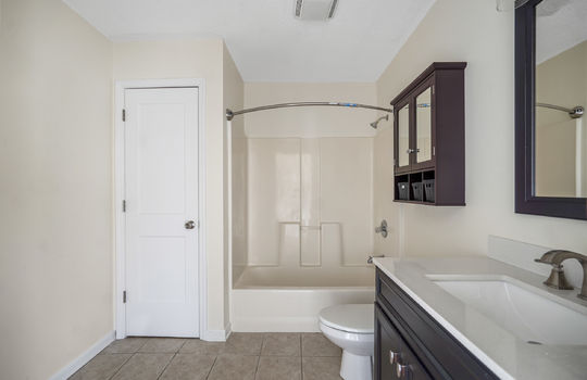bathroom, closet, shower/tub, sink, toilet, tile flooring