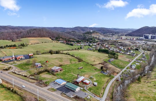 aerial view of property, road, parking lot, fields, mountain views, bristol motor speedway