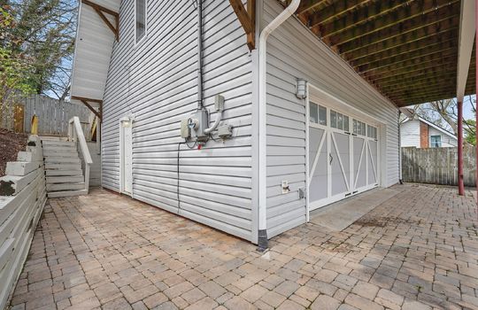bungalow, for lease, driveway, two car garage, metal roof, vinyl siding, back deck, fencing, stairs to main level