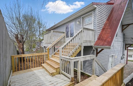 stairs to main level, front door, vinyl siding, metal roof, bungalow, for lease