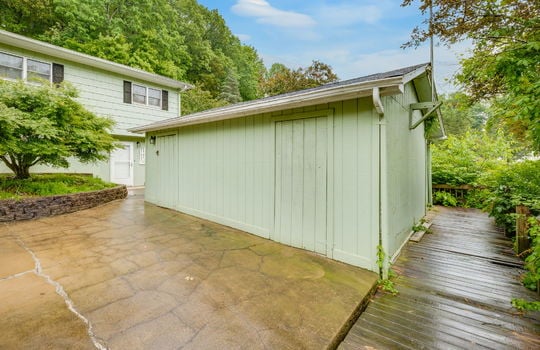 workshop, driveway, entry doors, split level home, lower level entry door, wood siding