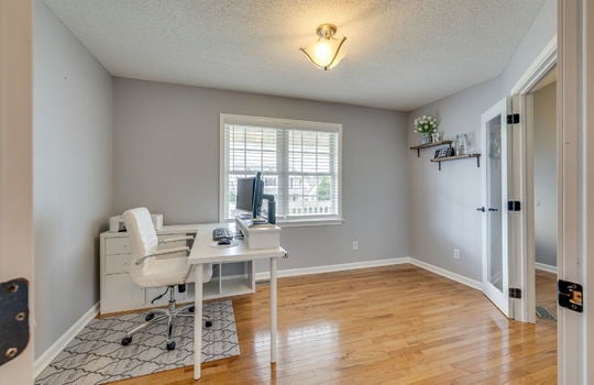 bedroom/office space, hardwood flooring, window pane door, window